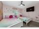 Princess themed bedroom with two twin-size beds at 2461 Reading Trl, Kissimmee, FL 34746