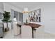 Elegant dining area with oval table and modern chairs at 2461 Reading Trl, Kissimmee, FL 34746