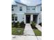 Modern two-story townhome with front yard and walkway at 2461 Reading Trl, Kissimmee, FL 34746