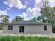 The backyard features a sliding glass door and several windows at 2531 Buena Vista Dr, Deland, FL 32724