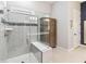 Large walk-in shower with gray tile and built-in seat at 2706 River Creek Ln # 2706, St Cloud, FL 34771