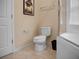 Bathroom with toilet, bathtub, and shower at 2717 Coupe St, Kissimmee, FL 34746