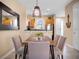 Cozy dining room featuring modern lighting, stylish furniture, and an open floor plan at 2717 Coupe St, Kissimmee, FL 34746