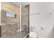 Bathroom with shower and toilet, tile flooring and a window at 2717 Shelby Ruth Pl, St Cloud, FL 34769