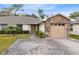 Inviting exterior with stone accents and a paved driveway at 2717 Shelby Ruth Pl, St Cloud, FL 34769