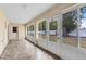 Screened porch with backyard view and tiled flooring at 2717 Shelby Ruth Pl, St Cloud, FL 34769