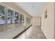 Spacious screened porch with tile flooring and backyard access at 2717 Shelby Ruth Pl, St Cloud, FL 34769