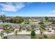 Aerial view of upscale homes on a golf course community at 296 Del Sol Ave, Davenport, FL 33837
