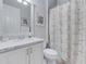 Clean bathroom with single vanity and shower/tub combo at 296 Del Sol Ave, Davenport, FL 33837