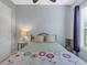 Cozy bedroom featuring a queen bed, ceiling fan, and calming decor at 296 Del Sol Ave, Davenport, FL 33837