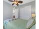 Well-lit bedroom with a queen bed, closet, and access to a bathroom at 296 Del Sol Ave, Davenport, FL 33837