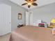 Bedroom with a queen-size bed and ceiling fan at 296 Del Sol Ave, Davenport, FL 33837