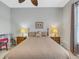 Spacious bedroom with a queen bed and ceiling fan at 296 Del Sol Ave, Davenport, FL 33837