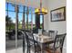 Bright dining room features a wood table with seating for six and a view to the backyard at 296 Del Sol Ave, Davenport, FL 33837