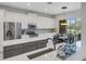 Kitchen with stainless steel appliances and view of backyard at 296 Del Sol Ave, Davenport, FL 33837