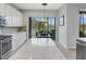 Kitchen with island, breakfast nook and view to backyard at 296 Del Sol Ave, Davenport, FL 33837