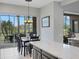 Kitchen with an island and breakfast area overlooking the golf course at 296 Del Sol Ave, Davenport, FL 33837