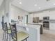 Open kitchen with stainless steel appliances and breakfast bar at 296 Del Sol Ave, Davenport, FL 33837