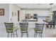 Modern kitchen with island and breakfast bar seating at 296 Del Sol Ave, Davenport, FL 33837