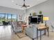 Living room with tiled floors, comfy seating, and large sliding glass doors at 296 Del Sol Ave, Davenport, FL 33837
