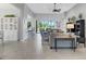 Spacious living room with tiled floors, comfortable seating, and access to a patio at 296 Del Sol Ave, Davenport, FL 33837