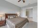 Main bedroom with king bed, ensuite bathroom access, and ceiling fan at 296 Del Sol Ave, Davenport, FL 33837