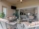 Relaxing outdoor patio with fire pit and seating area, overlooking the living room at 296 Del Sol Ave, Davenport, FL 33837