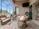 Outdoor patio with fire pit and comfortable seating at 296 Del Sol Ave, Davenport, FL 33837