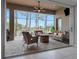 Spacious screened patio with fire pit, comfortable seating, and golf course views at 296 Del Sol Ave, Davenport, FL 33837