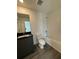 Main bathroom with tub, toilet and dark vanity with granite countertop at 3237 Energy Drive, Kissimmee, FL 34747