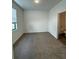 Bright bedroom with carpet flooring, window, and ensuite bathroom access at 3237 Energy Drive, Kissimmee, FL 34747