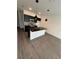 Modern kitchen with dark cabinetry, granite island, and pendant lights at 3237 Energy Drive, Kissimmee, FL 34747