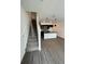 Open concept kitchen with island and modern dark cabinetry at 3237 Energy Drive, Kissimmee, FL 34747