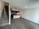 Open concept kitchen with island and modern dark cabinetry at 3237 Energy Drive, Kissimmee, FL 34747