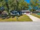 Single-story home with a driveway and mailbox at 3316 Planter Dr, Deltona, FL 32738