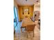 Dining room with a wooden table, neutral walls, and access to a patio at 421 Disa Dr, Davenport, FL 33837