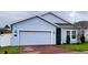 Light blue house with two-car garage at 421 Disa Dr, Davenport, FL 33837