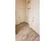 Bright hallway with wood-look tile flooring and access to multiple rooms at 421 Disa Dr, Davenport, FL 33837