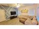 Spacious living room with sectional sofa and wood-look floors at 421 Disa Dr, Davenport, FL 33837