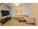 Spacious living room with sectional sofa and wood-look floors at 421 Disa Dr, Davenport, FL 33837
