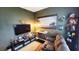 Media room with large TV, comfortable seating, and entertainment center at 421 Disa Dr, Davenport, FL 33837
