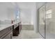 Elegant bathroom with double vanity, soaking tub, and walk-in shower at 4370 Rhyme St, Kissimmee, FL 34746