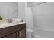 Clean bathroom with tub shower combo and dark vanity at 4370 Rhyme St, Kissimmee, FL 34746