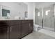 Modern bathroom with double vanity and glass shower at 4370 Rhyme St, Kissimmee, FL 34746
