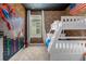 Spiderman themed bedroom with bunk bed and brick feature wall at 4370 Rhyme St, Kissimmee, FL 34746