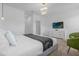 Bright bedroom with large bed, dresser, and green velvet chair at 4370 Rhyme St, Kissimmee, FL 34746