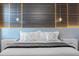Modern bedroom with a wood wall and accent lighting at 4370 Rhyme St, Kissimmee, FL 34746