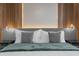 Modern bedroom with wood accent wall and large bed at 4370 Rhyme St, Kissimmee, FL 34746