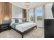 Modern bedroom with wood accent wall and large bed at 4370 Rhyme St, Kissimmee, FL 34746