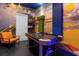 Game room with air hockey table and seating at 4370 Rhyme St, Kissimmee, FL 34746